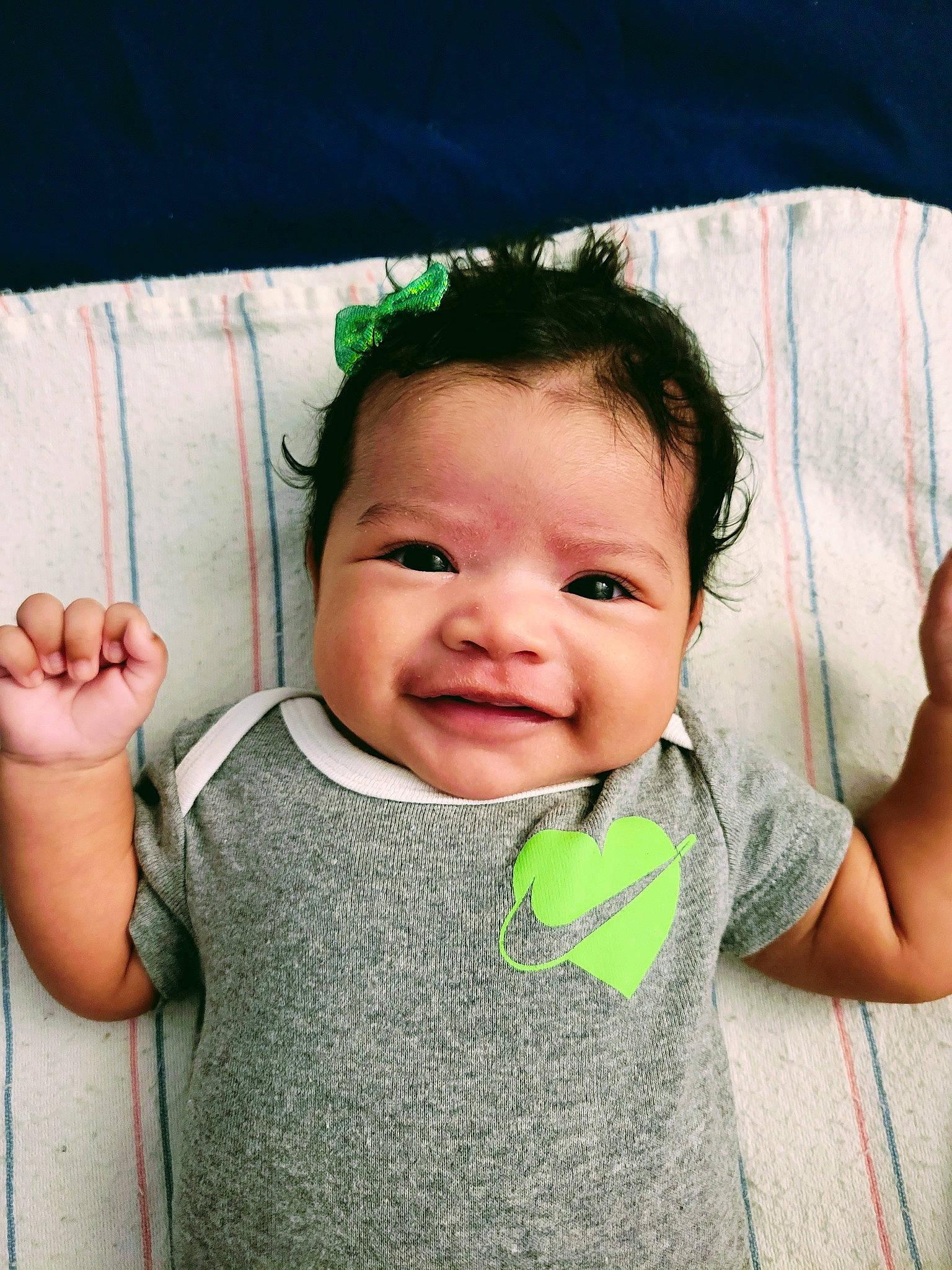 Amira is registered to the contest to win money with this photo: arm, baby_toddler_clothing, cheek, chin, eye, eyebrow, eyelash, gesture, hair, hairstyle, hand, happy, head, lip, mouth, neck, nose, person, skin, sleeve