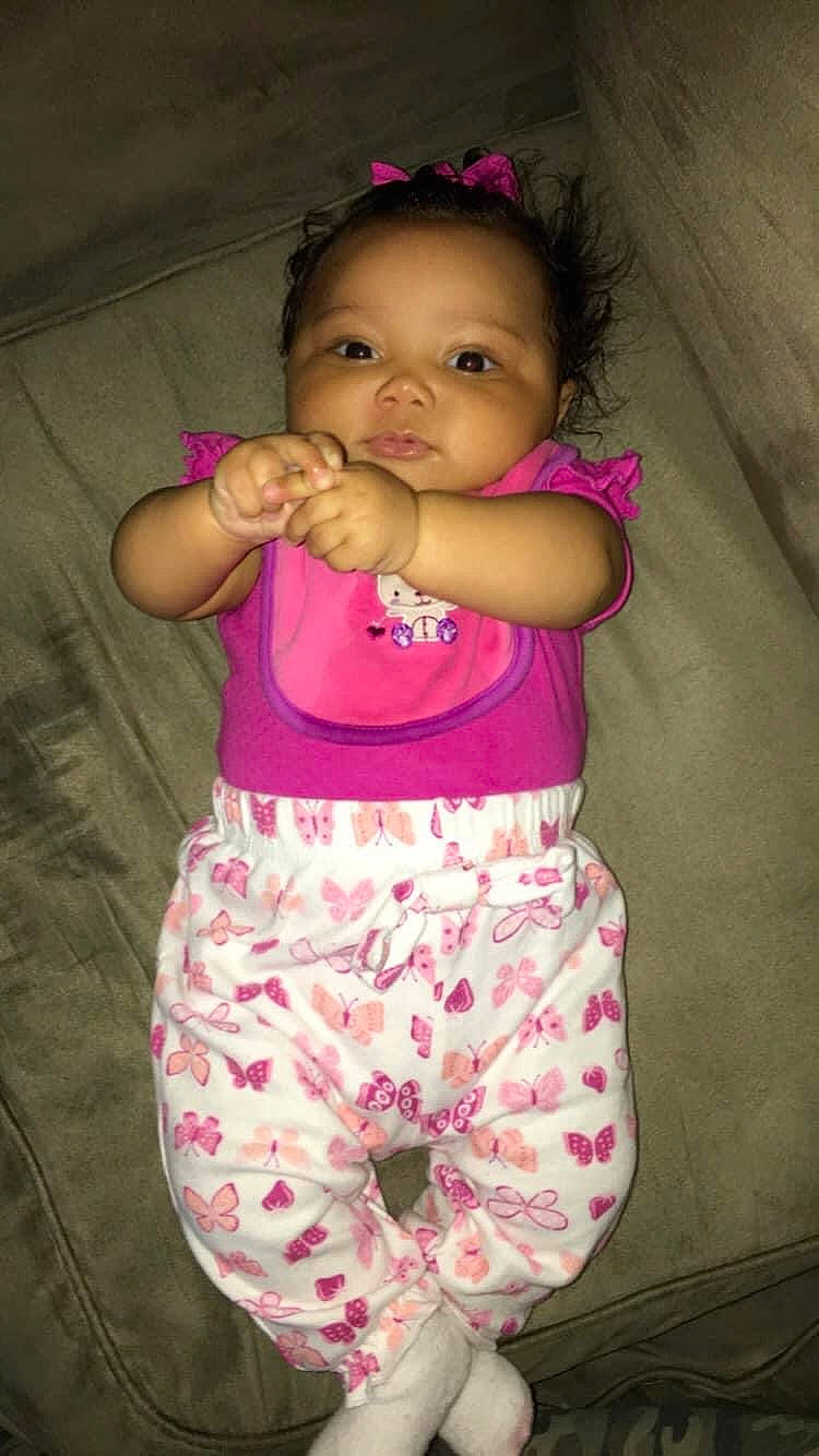 Miah is registered to the contest to win money with this photo: baby_toddler_clothing, cheek, chin, eye, face, hair, happy, head, human_body, iris, leg, lip, nose, organ, person, pink, purple, skin, sleeve, textile