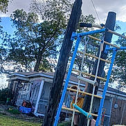 Joshua Leopard joined the competition — help win amazing prizes! child, playground, climbing, ladder, outdoor, yard, house, trees, grass, sky, clouds, wood, metal, rope, casual_clothing, daytime, fun, activity, person, recreation