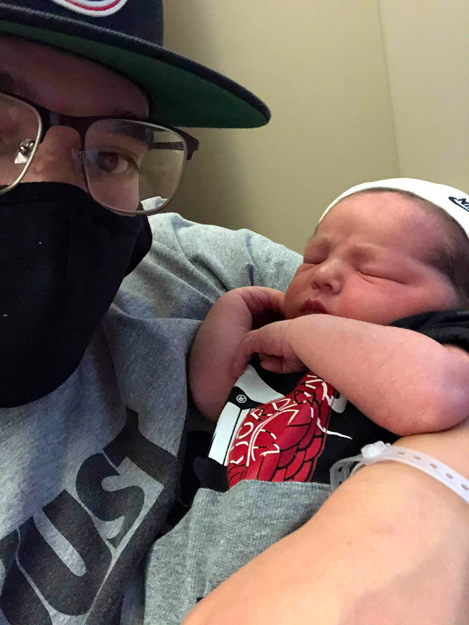 Bryxton is registered to the contest to win money with this photo: baby, baby_sleeping, baby_toddler_clothing, birth, child, childbirth, comfort, costume_accessory, costume_hat, eyewear, fedora, glasses, hat, headgear, human, person, skin, sleep, sun_hat, toddler