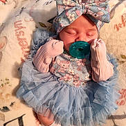 Emersyn joined the competition — help win amazing prizes! baby, infant, sleeping, pacifier, headband, bow, mittens, blue_dress, ruffles, blanket, floral, cute, newborn, soft, cozy, child, lying_down, adorable, peaceful, clothing