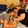 Lucifer is registered to the contest to win money with this photo: boy, woman, dog, bed, cuddle, kiss, smile, indoor, blanket, pillow, casual, watch, human, pet, affection, family, relaxation, comfort, home, love