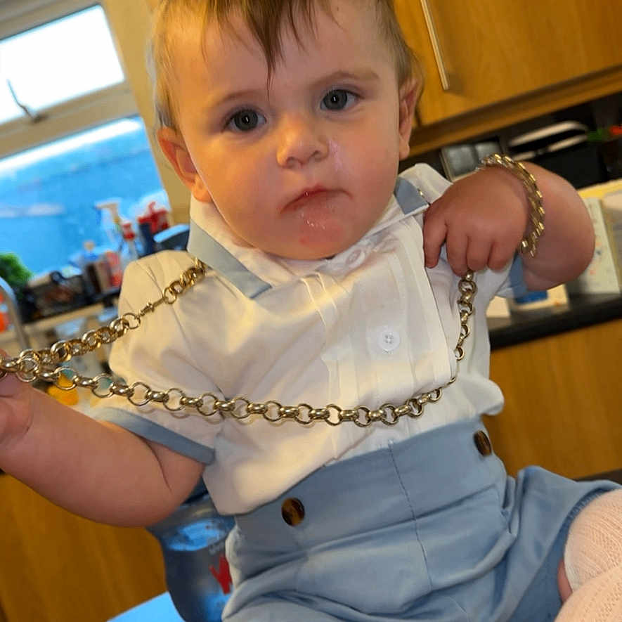 Romeo joined the competition — help win amazing prizes! accessories, baby, bodypart, bracelet, clothing, face, finger, footwear, furniture, hand, hardwood, head, jewelry, necklace, pants, person, plywood, shoe, shorts, wood