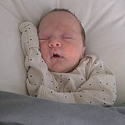 Evelyn joined the competition — help win amazing prizes! baby, sleeping, blanket, bed, infant, newborn, clothing, face, hand, cozy, soft, peaceful, rest, cute, indoors, person, portrait, skin, head, toddler