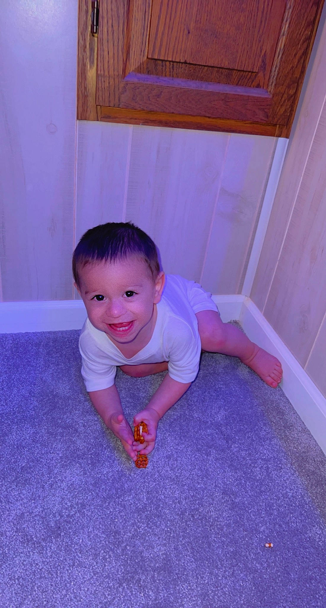 Jasiah joined the competition — help win amazing prizes! baby, baby_toddler_clothing, carpet, cheek, child, crawling, floor, flooring, fun, hardwood, human_leg, joy, leg, pattern, person, sitting, smile, t_shirt, toddler, wood