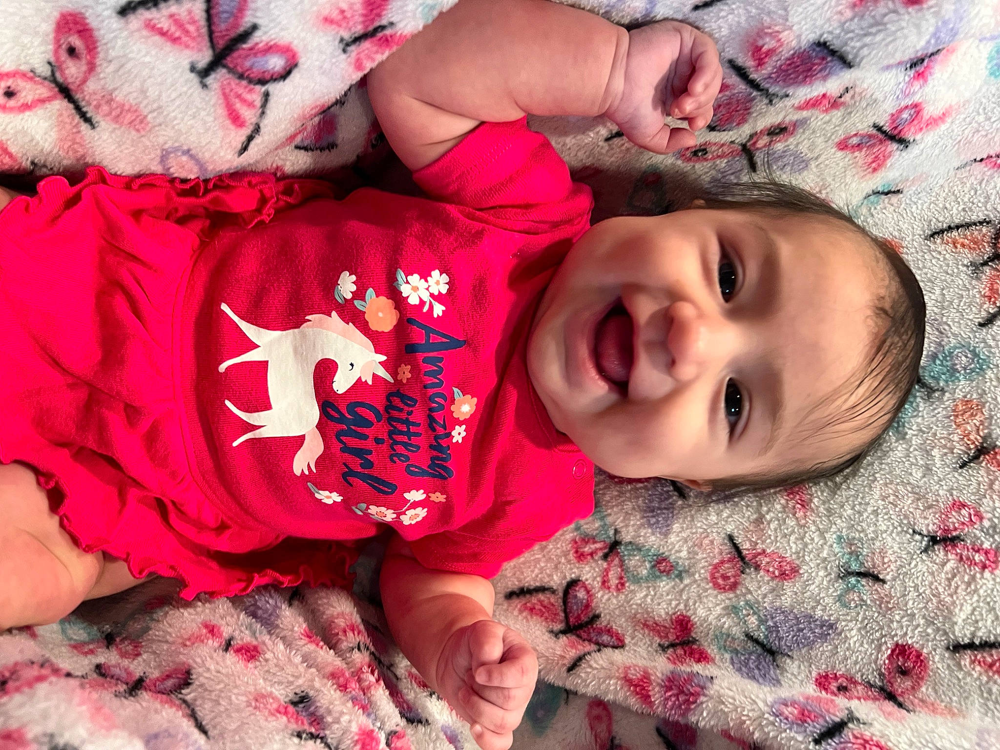 Nyla joined the competition — help win amazing prizes! baby, baby_toddler_clothing, cheek, eye, face, facial_expression, finger, happy, head, human_body, joy, lip, mouth, nose, person, pink, red, skin, sleeve, smile