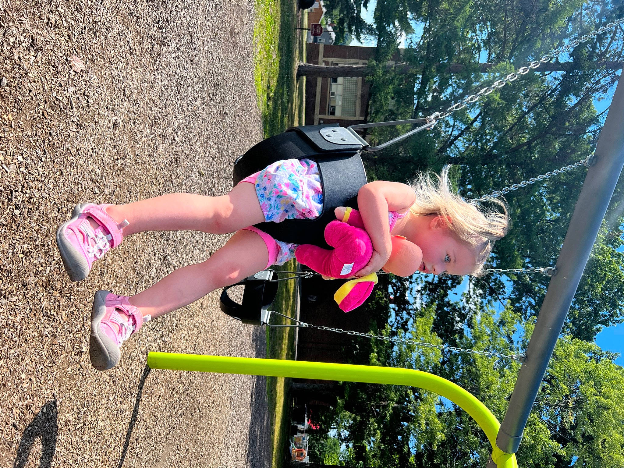 Raelynn is registered to the contest to win money with this photo: balance, boot, child, fun, grass, happy, human_leg, leisure, magenta, outdoor_play_equipment, people_in_nature, person, pink, plant, playground, recreation, shorts, sneakers, thigh, toddler