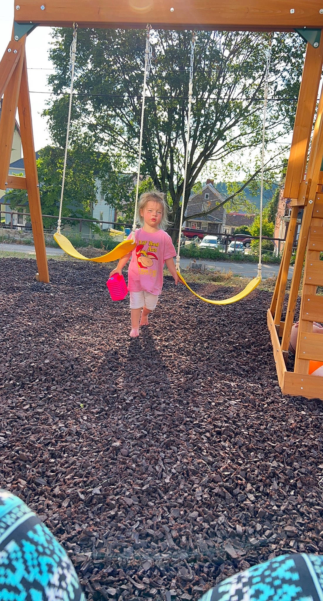 Raelynn joined the competition — help win amazing prizes! asphalt, child, city, fun, grass, human_settlement, leisure, nature, outdoor_play_equipment, people_in_nature, person, plant, play, playground, recreation, swing, tire, toddler, tree, wood