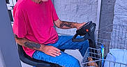 Pee Wee joined the competition — help win amazing prizes! basket, blue_jeans, brick_wall, camouflage_cap, dog, door, entrance, man, mobility_scooter, mustache, outdoor, pet_carrier, pink_shirt, seated, shopping_cart, small_dog, sneakers, tattoos, transportation, warning_sign
