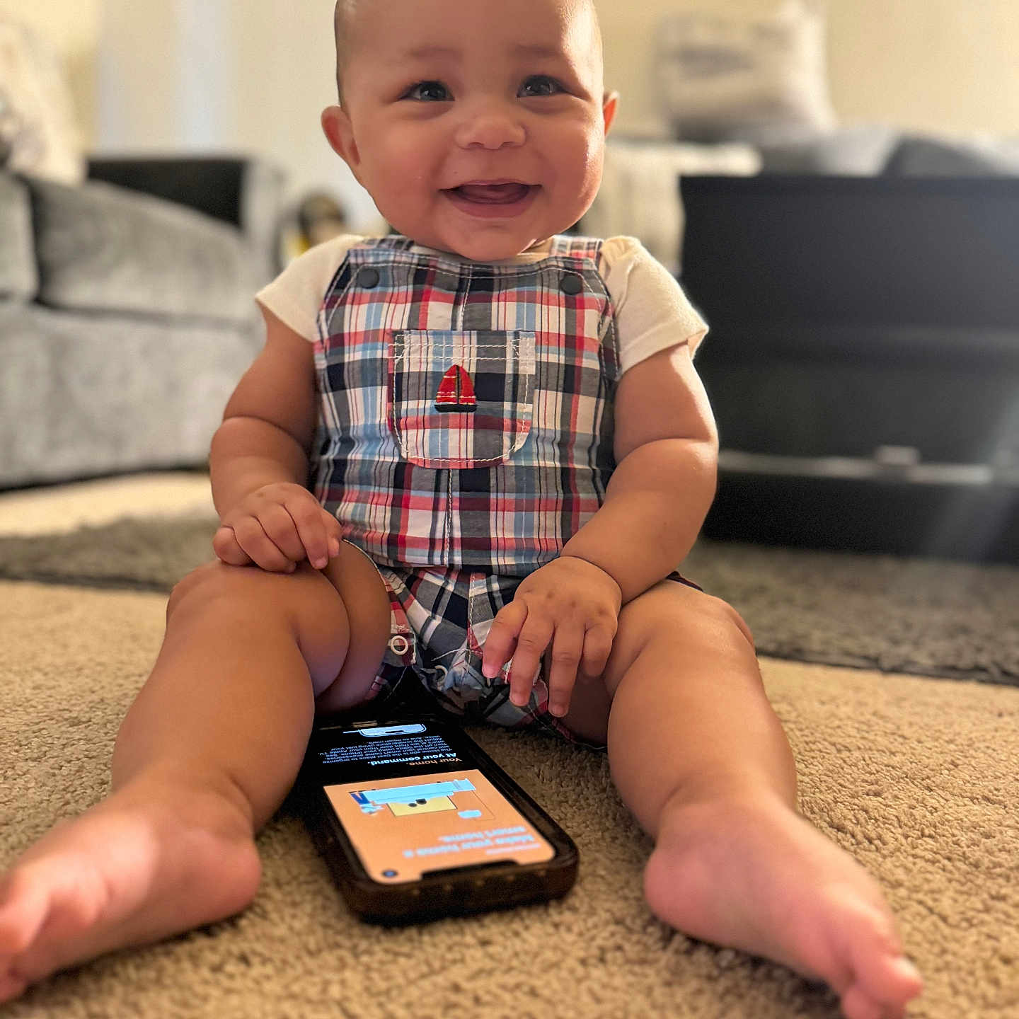 Donald joined the competition — help win amazing prizes! architecture, baby, bodypart, building, couch, electronics, face, finger, furniture, hand, head, indoors, livingroom, mobilephone, person, phone, photography, portrait, room, sitting