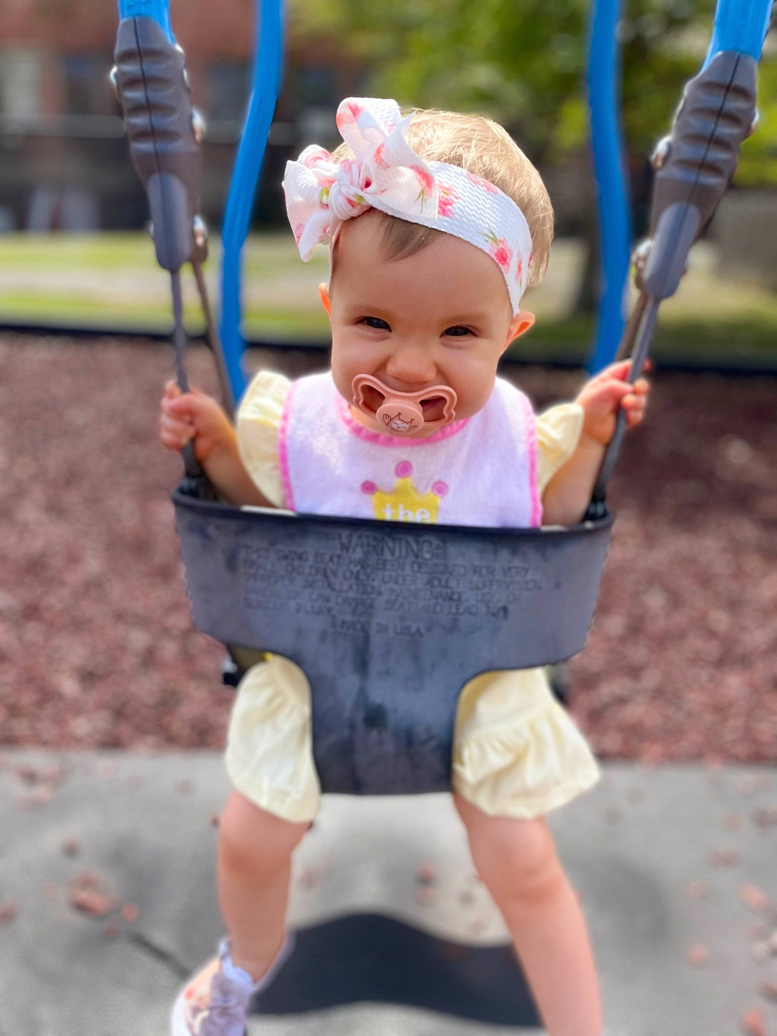 Brooklyn is registered to the contest to win money with this photo: baby, baby_toddler_clothing, blue, child, fun, grass, happy, hat, headwear, leisure, person, photograph, pink, product, recreation, sleeve, smile, snapshot, summer, swing