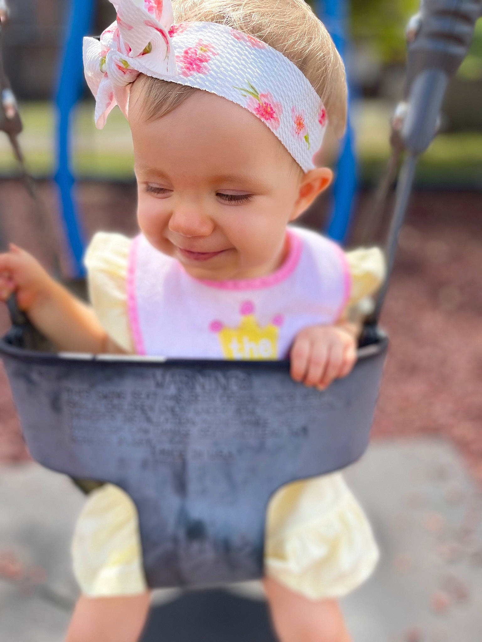 Brooklyn is registered to the contest to win money with this photo: baby, baby_carriage, baby_products, baby_toddler_clothing, cap, cheek, child, eye, facial_expression, fashion_accessory, fun, grass, happy, headwear, leisure, person, photograph, pink, skin, smile