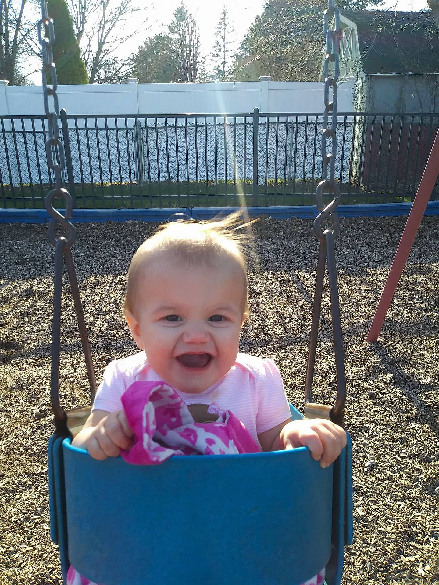 Leiana joined the competition — help win amazing prizes! child, day, fun, girl, grass, infant, outdoor_play_equipment, person, plant, play, playground, product, public_space, recreation, smile, swing, toddler, tree, vacation