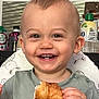 toddler, child, smiling, happy, croissant, food, eating, face, hair, moawk, kitchen, background, sitting, highchair, clothing, bracelet, portrait, cute, indoor, breakfast