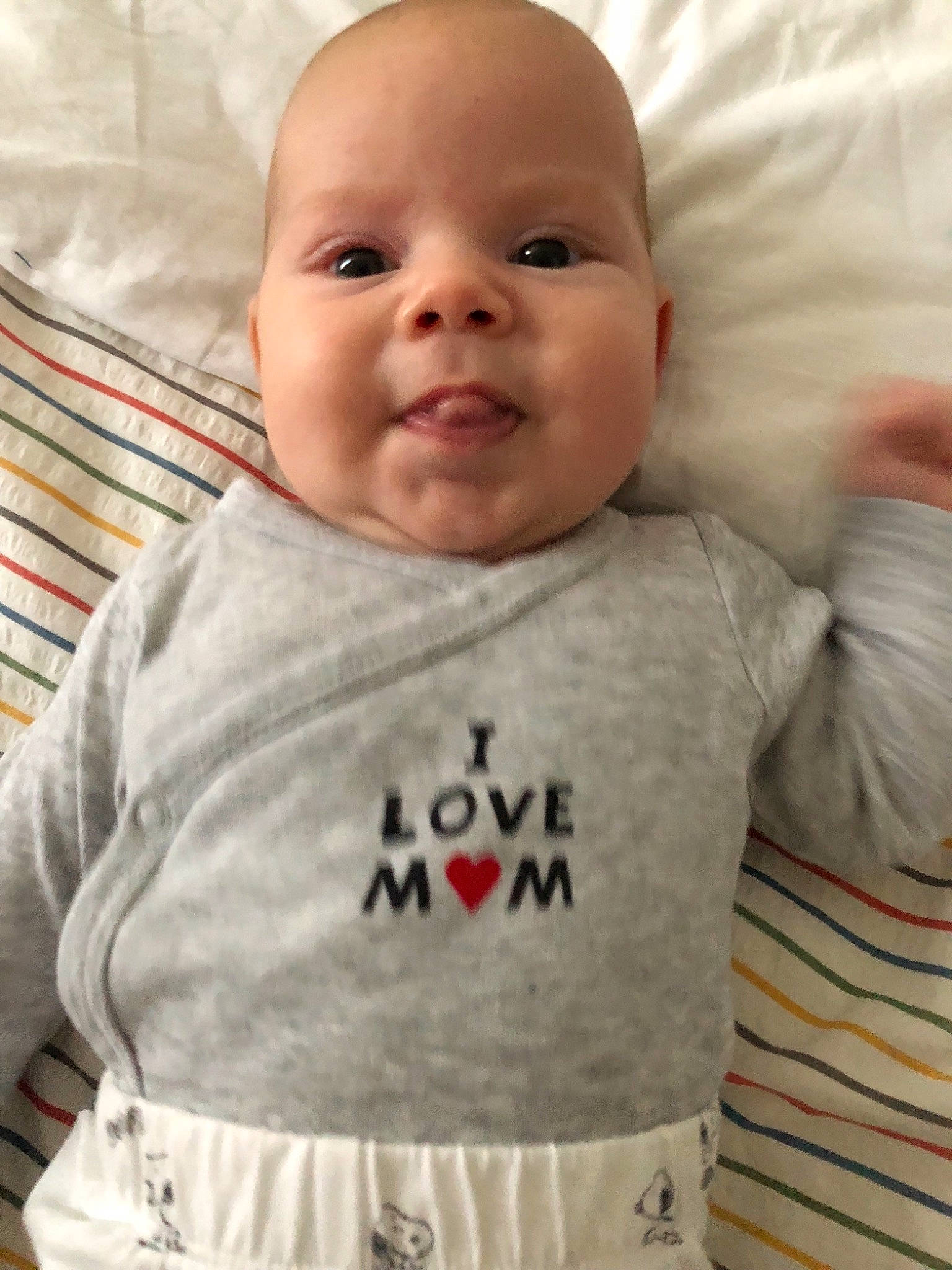 Andrei participe au concours pour gagner de l'argent avec cette photo : baby, baby_products, baby_toddler_clothing, cheek, child, face, facial_expression, head, lip, mouth, nose, person, product, skin, sleeve, smile, t_shirt, toddler