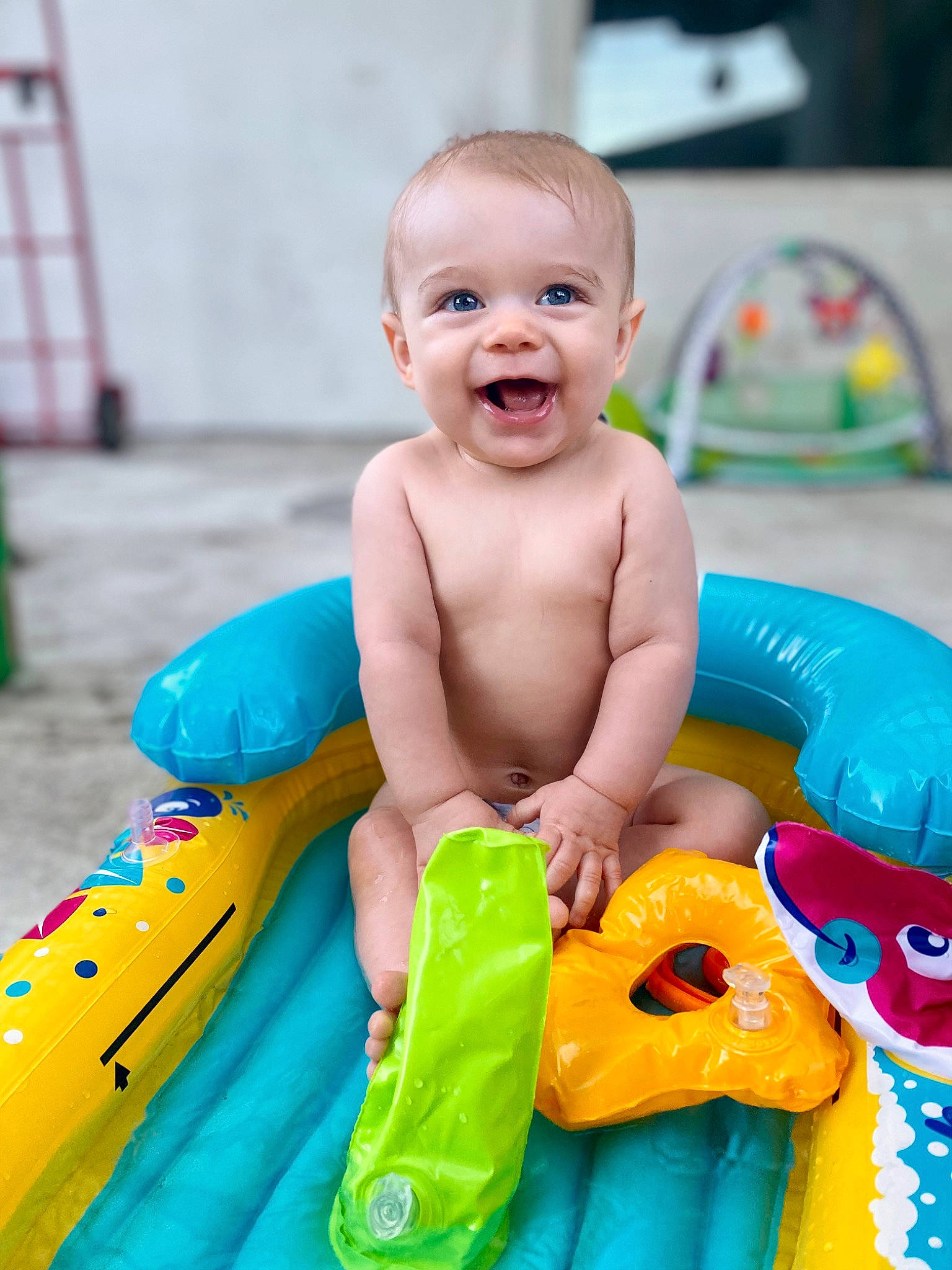 Kamdyn is registered to the contest to win money with this photo: aqua, baby, baby_playing_with_toys, baby_products, baby_toys, child, fun, games, happy, inflatable, joy, leisure, party_supply, person, plastic, play, product, recreation, smile, summer