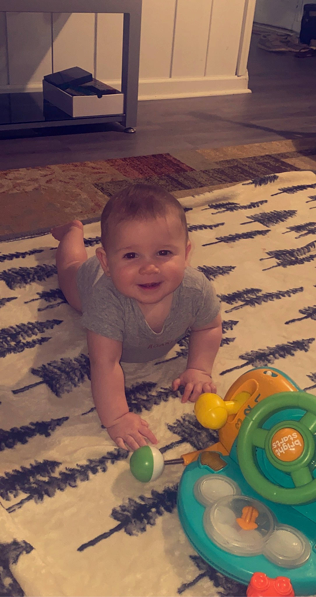 Leo joined the competition — help win amazing prizes! baby, black, cheek, eye, facial_expression, floor, flooring, green, happy, head, iris, light, mouth, organ, person, photograph, skin, smile, toddler, toy