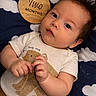 Noah joined the competition — help win amazing prizes! baby, infant, two_months, onesie, bear_graphic, cloud_pattern, blanket, curious, cute, lying_down, hands, face, portrait, child, soft_lighting, indoors, young_baby, clothing, skin, expression