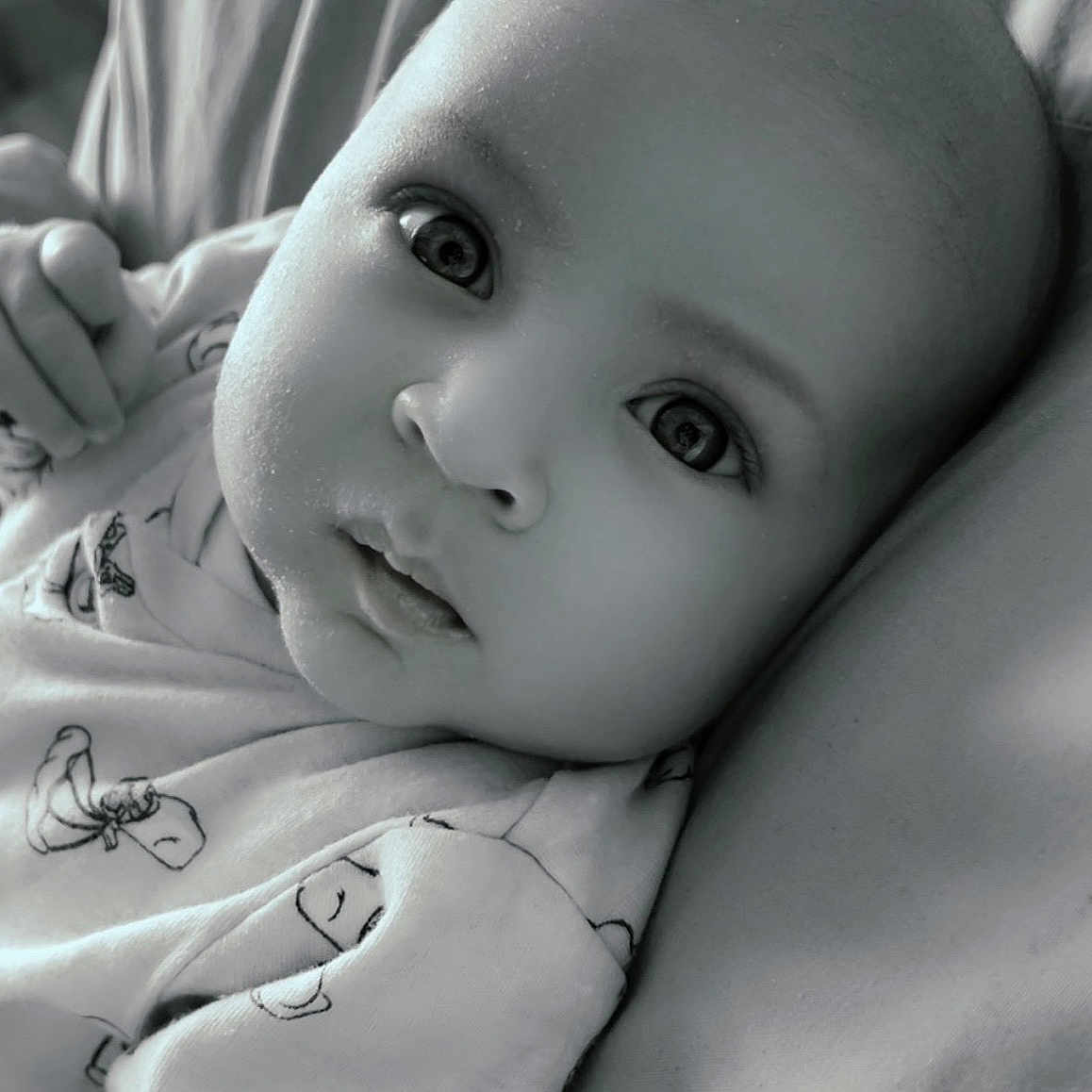 Roman-Blue is registered to the contest to win money with this photo: baby, bed, blanket, bodypart, cushion, face, finger, furniture, hand, happy, head, newborn, person, photography, portrait, quilt, selfie, skin, smile, toy