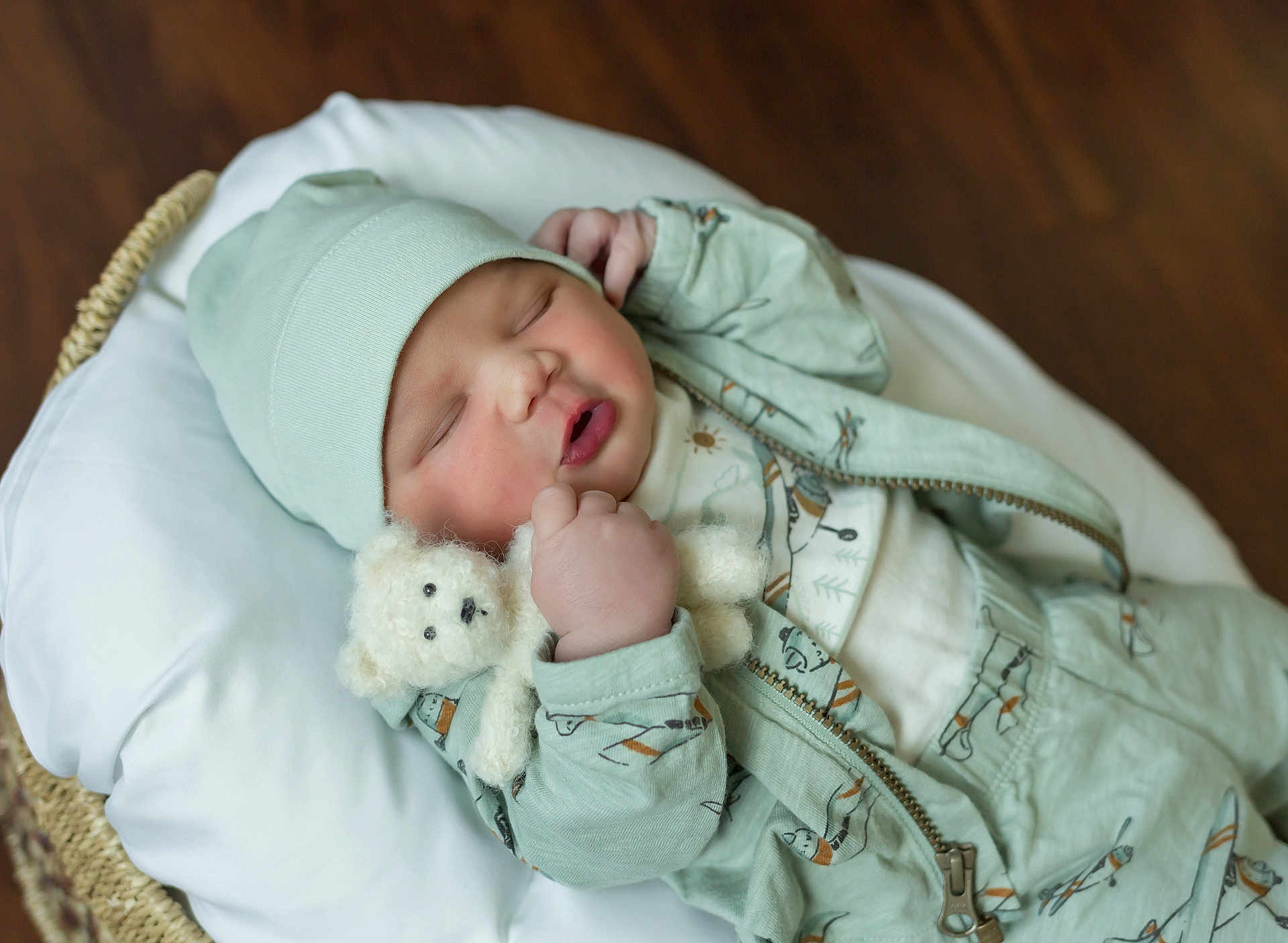 Reign joined the competition — help win amazing prizes! baby, bed, blanket, bodypart, bonnet, cap, clothing, cradle, crib, face, finger, furniture, hand, hardwood, hat, head, newborn, person, sleeping, wood