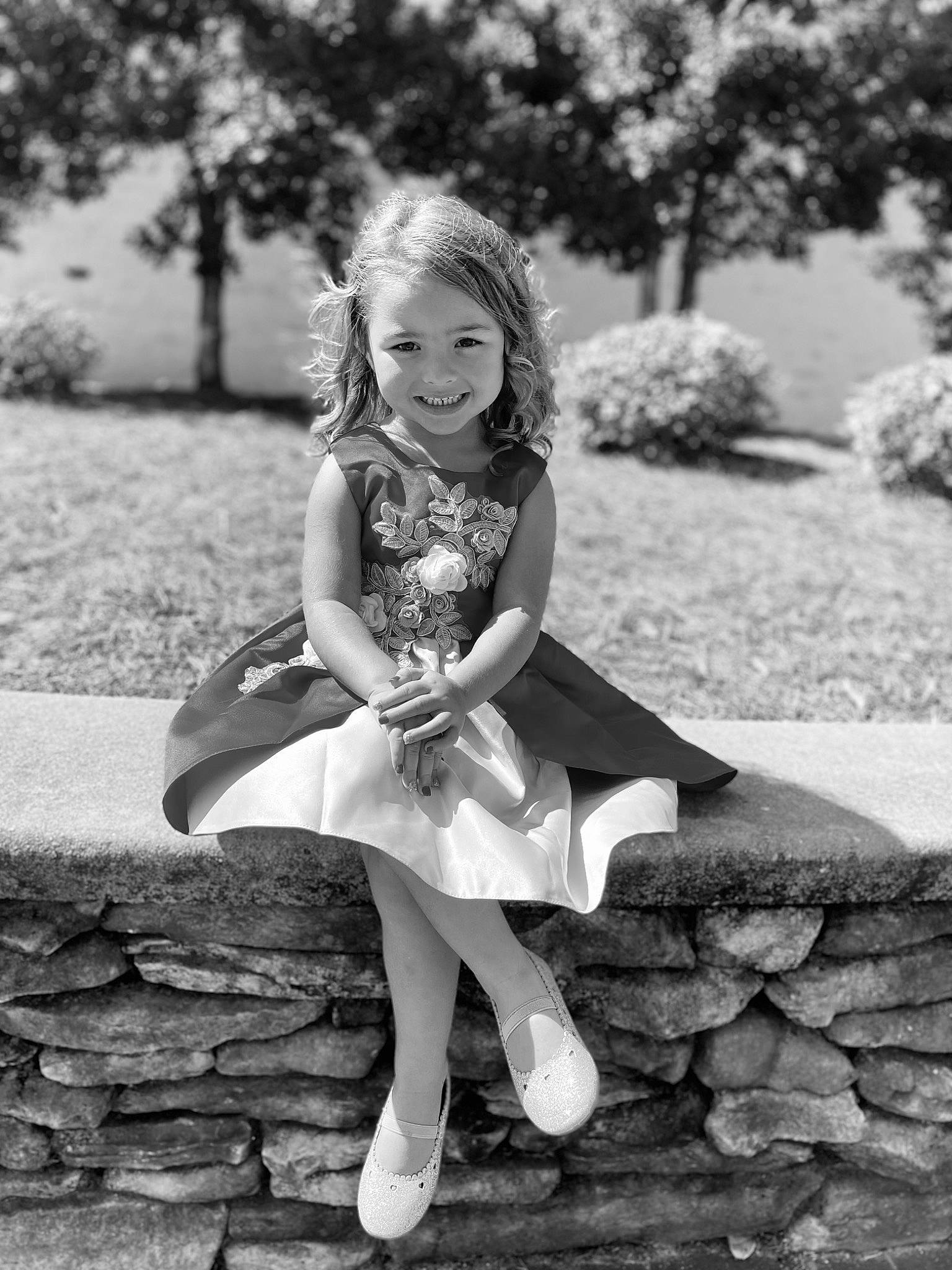 Abbigail joined the competition — help win amazing prizes! black_and_white, clothing, dress, facial_expression, flash_photography, grass, happy, joy, leg, monochrome, monochrome_photography, people_in_nature, person, photograph, plant, smile, standing, style, toddler, tree