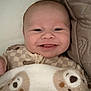 Mylo joined the competition — help win amazing prizes! baby, smiling, blanket, bear_pattern, quilted_fabric, face, infant, cozy, cute, lying_down, happy, child, soft_texture, comfort, portrait, indoors, closeup, warm, sleepwear, expression