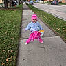 Amelia is registered to the contest to win money with this photo: child, toddler, sidewalk, pink_hat, blue_jacket, dinosaur_costume, halloween_bucket, grass, trees, suburban, residential_area, car, autumn, fall_leaves, outdoor, smiling, playful, concrete, street, daytime