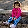 Nidhira Avirneni joined the competition — help win amazing prizes! blue_jeans, casual, child, curb, daylight, gravel, ground, hair, happy, hoodie, nature, outdoor, pine_needles, pink_clothing, portrait, sitting, slippers, smiling, sunlight, toddler