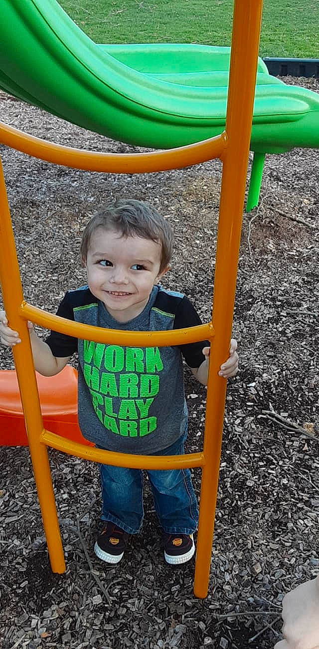 Eddie joined the competition — help win amazing prizes! child, city, fun, human_settlement, joy, leisure, outdoor_play_equipment, person, play, playground, public_space, recreation, smile, toddler, yellow