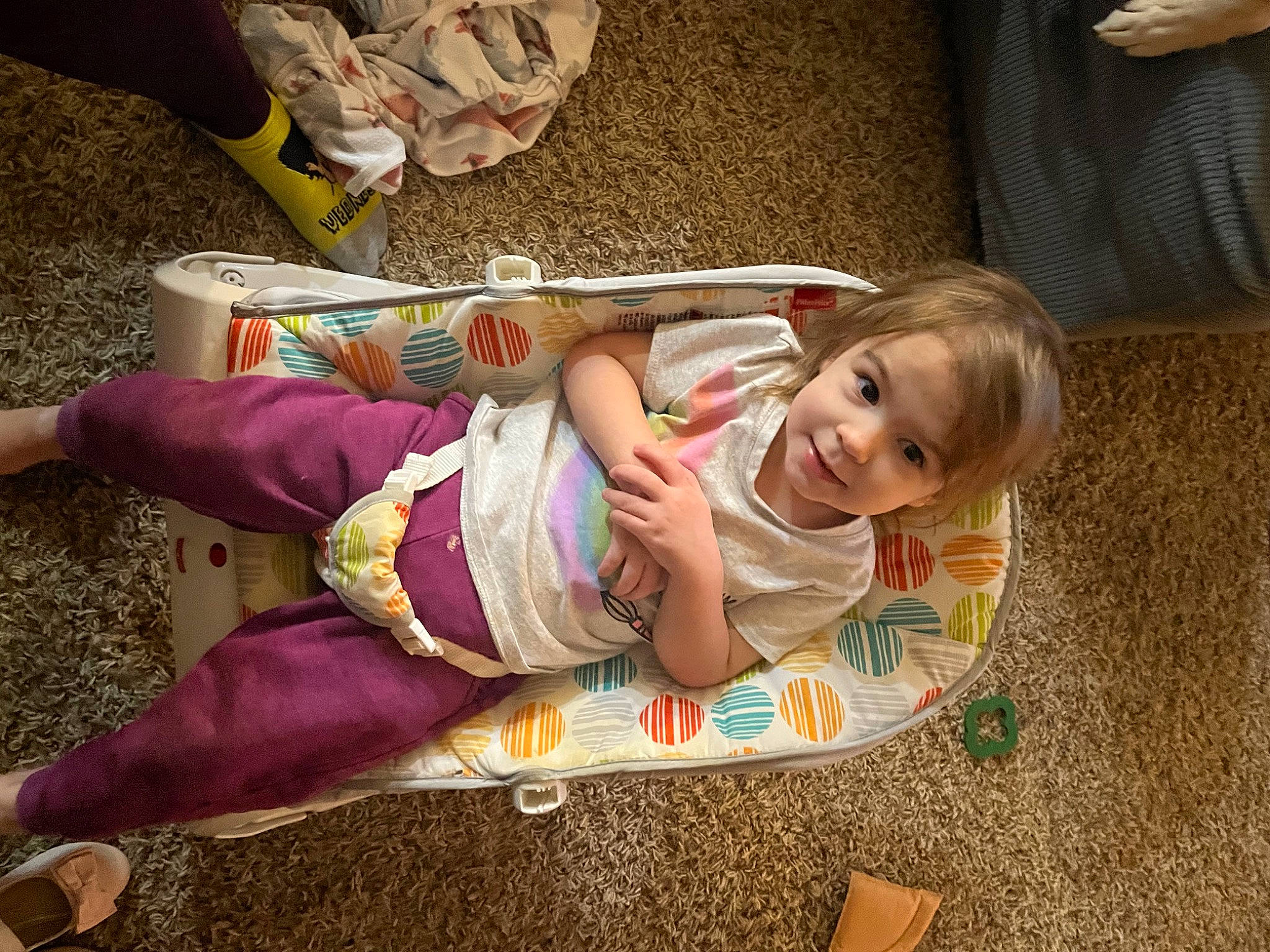 Alaina is registered to the contest to win money with this photo: baby, baby_toddler_clothing, child, comfort, flooring, foot, fun, grass, happy, human_leg, knee, lap, leisure, person, room, sitting, smile, sock, thigh, toddler