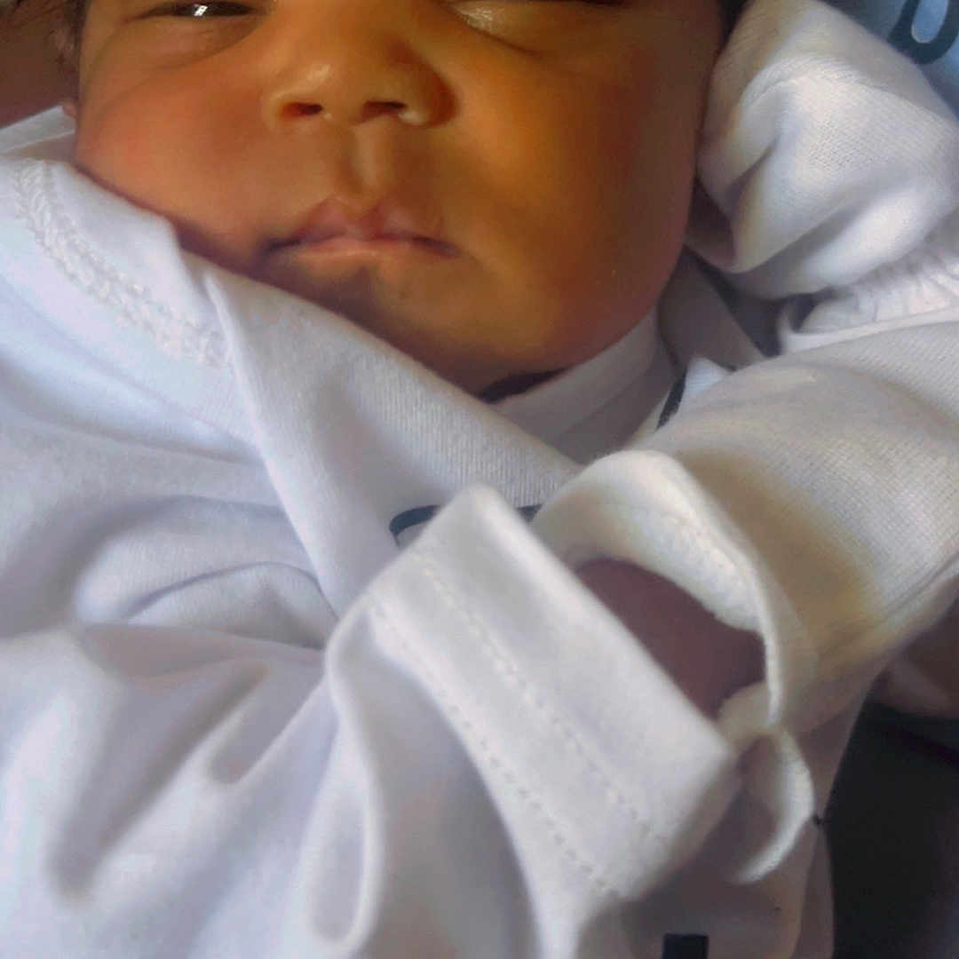 Jamoni is registered to the contest to win money with this photo: architecture, baby, bed, blanket, building, clothing, cushion, face, furniture, glove, head, homedecor, hospital, newborn, person, photography, portrait, quilt, shirt, sleeping