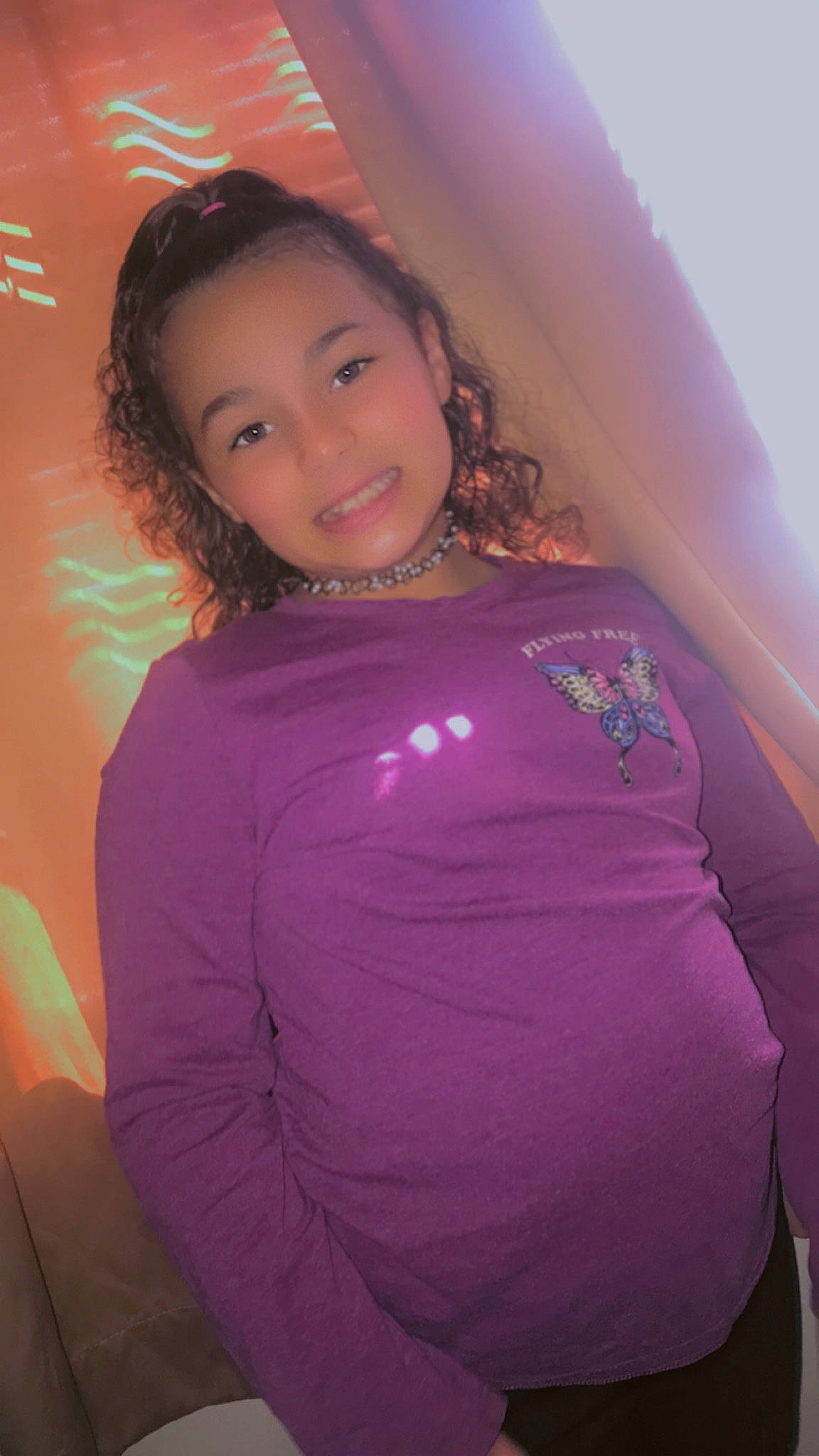 Santana joined the competition — help win amazing prizes! arm, black_hair, eye, eyebrow, face, flash_photography, hair, happy, head, joy, lip, long_hair, magenta, neck, person, pink, purple, shoulder, sleeve, smile