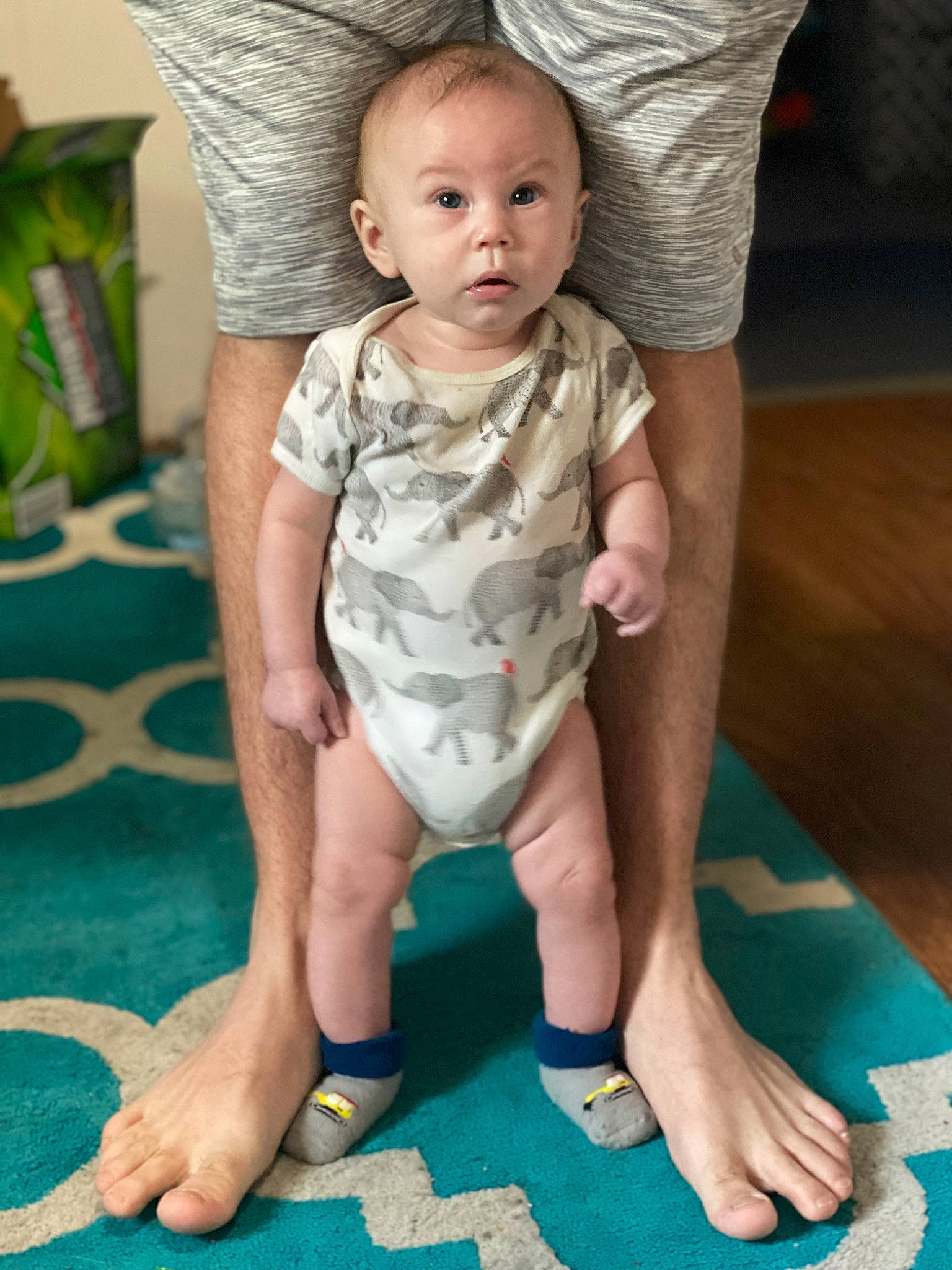 Kaysen is registered to the contest to win money with this photo: baby, baby_toddler_clothing, comfort, eye, face, finger, flooring, green, head, human_body, joint, knee, leg, neck, person, shoulder, skin, sleeve, stomach, surprise