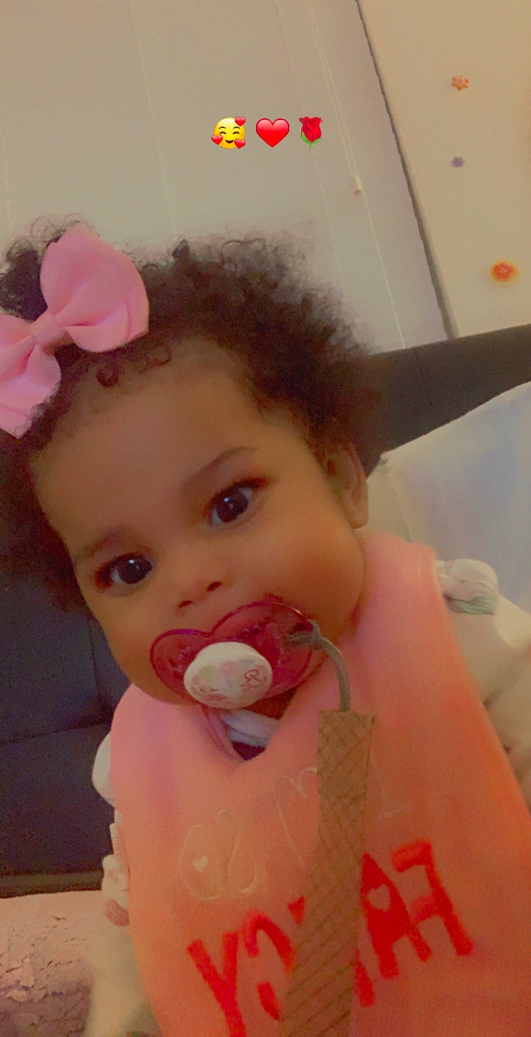 Peyton is registered to the contest to win money with this photo: baby, baby_toddler_clothing, cheek, child, dress, eyebrow, eyelash, face, facial_expression, flower, happy, headgear, iris, lip, neck, nose, person, petal, pink, skin