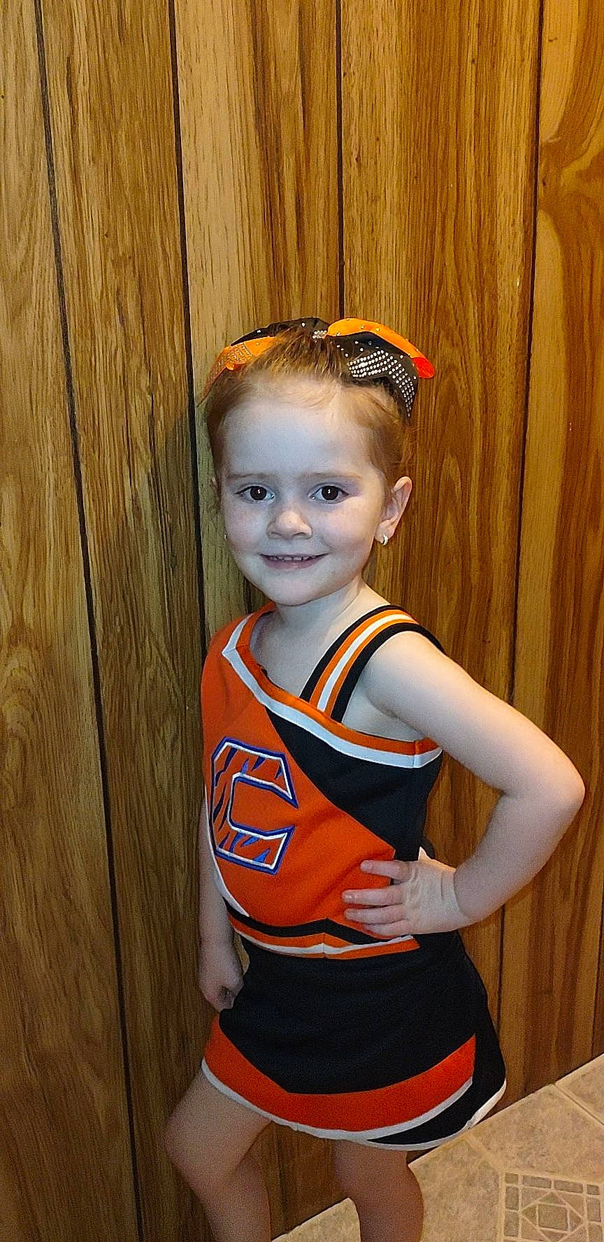Veronica is registered to the contest to win money with this photo: abdomen, cheerleading_uniform, electric_blue, eye, flash_photography, happy, headband, headpiece, jersey, joy, person, personal_protective_equipment, sleeve, smile, sports_uniform, sportswear, t_shirt, thigh, toddler, trunk
