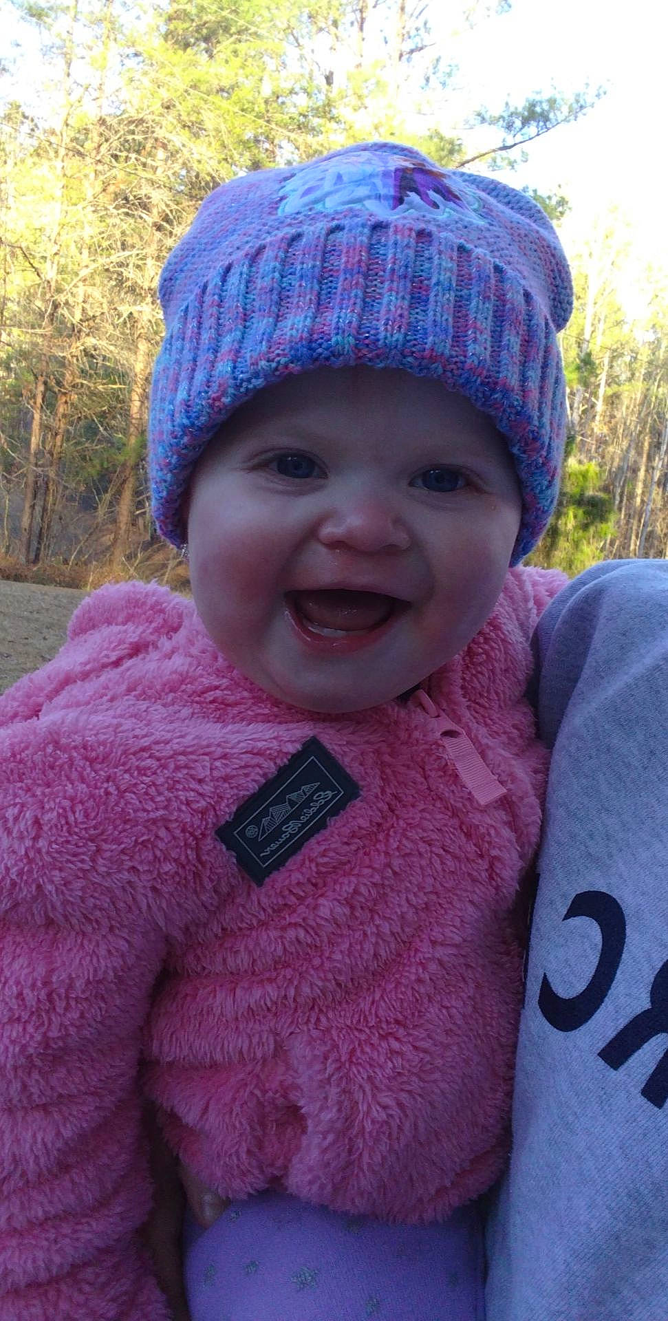 Alyvia joined the competition — help win amazing prizes! cap, clothing, cool, eye, grass, happy, head, headgear, headwear, leaf, lip, magenta, outerwear, person, photograph, pink, product, purple, sleeve, smile