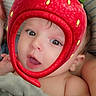 Caspian is registered to the contest to win money with this photo: baby, blanket, child, cushion, cute, expression, eyes, face, filter, headwear, indoors, infant, mouth, person, portrait, skin, soft, strawberry, striped, young