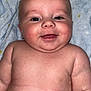 Lennox joined the competition — help win amazing prizes! baby, smiling, face, skin, chubby, lying_down, blanket, blue, infant, closeup, cute, happy, child, young, portrait, indoors, soft, expression, head, eyes