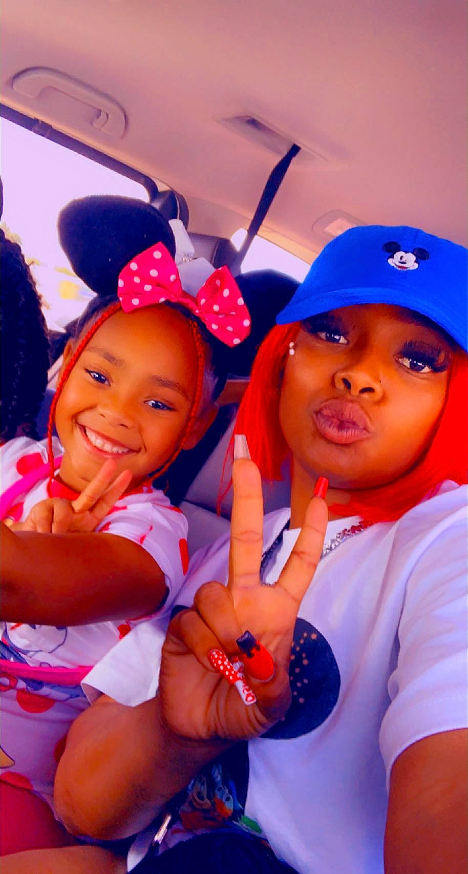 Makaylah is registered to the contest to win money with this photo: baseball_cap, blue, cap, clothing, electric_blue, finger, fun, gesture, happy, hat, headgear, joy, orange, person, pink, red, smile, sports_uniform, t_shirt, thumb