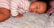 Lauryn joined the competition — help win amazing prizes! baby, sleeping, pajamas, pink, white, striped, blanket, soft, cozy, infant, face, peaceful, child, cute, rest, nap, indoors, fuzzy, hand, portrait