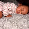 baby, sleeping, pajamas, pink, white, striped, blanket, soft, cozy, infant, face, peaceful, child, cute, rest, nap, indoors, fuzzy, hand, portrait