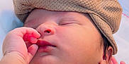 Ayura joined the competition — help win amazing prizes! baby, sleeping, infant, hat, knit_cap, hand, face, skin, closeup, child, newborn, cute, peaceful, resting, soft_light, blanket, cushion, indoors, portrait, white_cloth