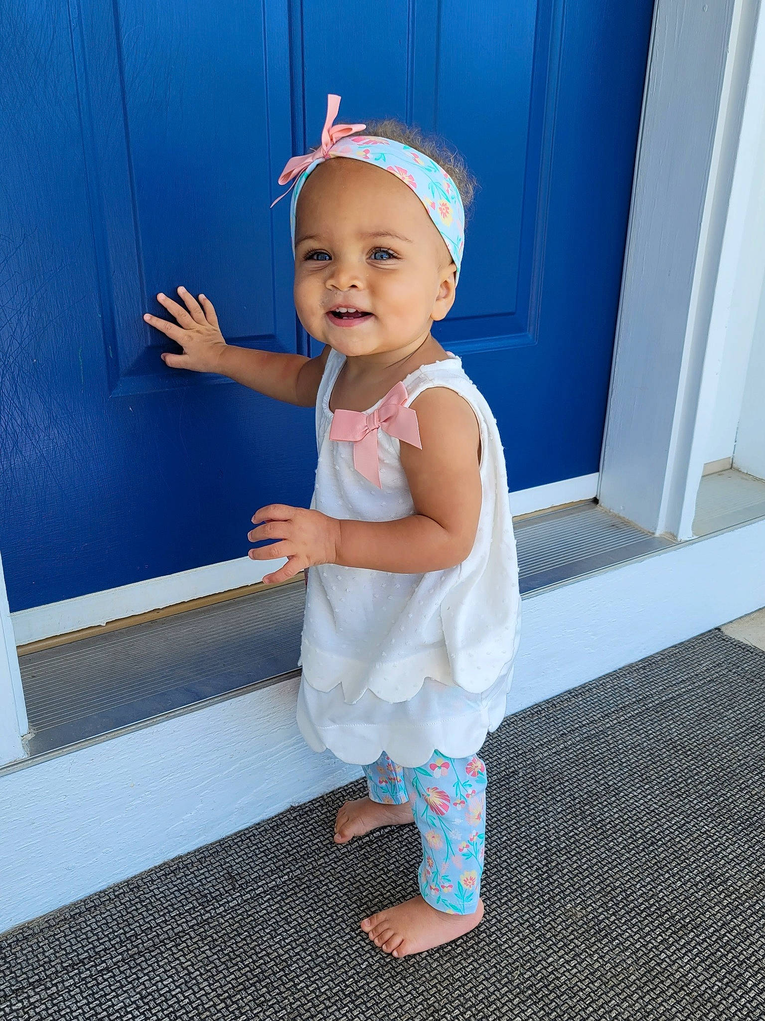 Emilah joined the competition — help win amazing prizes! baby, baby_toddler_clothing, blue, child, day_dress, door, dress, electric_blue, flooring, fun, happy, hat, headwear, human_leg, joy, pattern, person, room, sleeve, smile