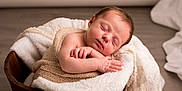 Bonnie participe au concours pour gagner de l'argent avec cette photo : newborn, baby, sleeping, wooden_bucket, blanket, knit, lace, soft_fabric, infant, peaceful, wrapped, cute, portrait, indoors, cozy, resting, child, skin, head, hands