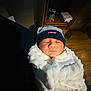 accessories, architecture, baby, bag, bed, blanket, bonnet, building, cap, clothing, face, furniture, handbag, hat, head, newborn, person, photography, portrait, sleeping