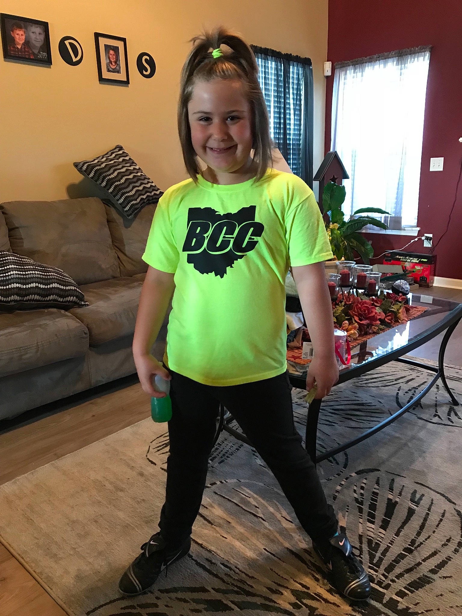 Brookelynn is registered to the contest to win money with this photo: clothing, day, fashion_accessory, flooring, footwear, fun, girl, joint, joy, leg, person, product, shoe, shoulder, smile, standing, t_shirt, textile