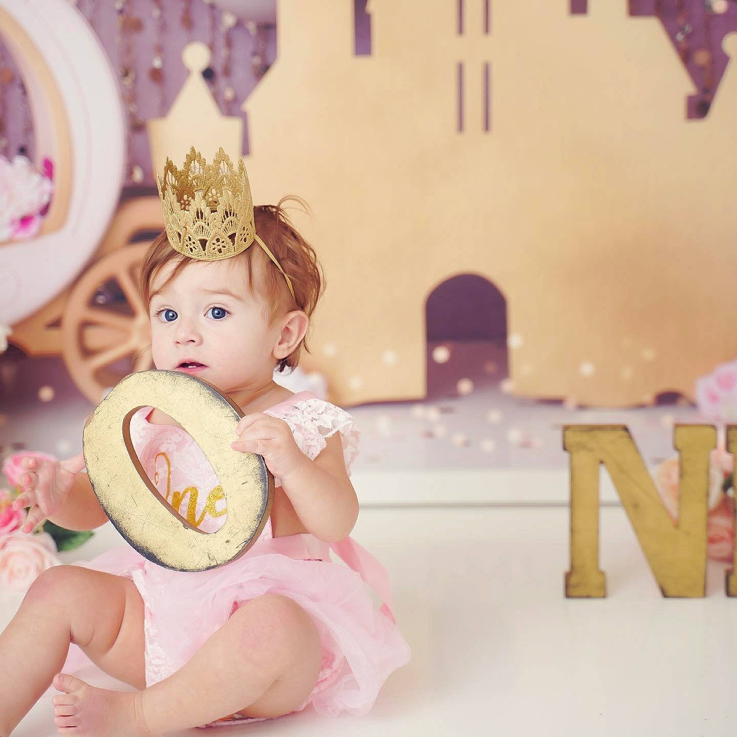 Lily is registered to the contest to win money with this photo: baking, child, crown, doll, fashion_accessory, font, hair_accessory, happy, headpiece, icing, jewellery, peach, person, pink, room, sitting, sugar_cake, surprise, sweetness, teddy_bear