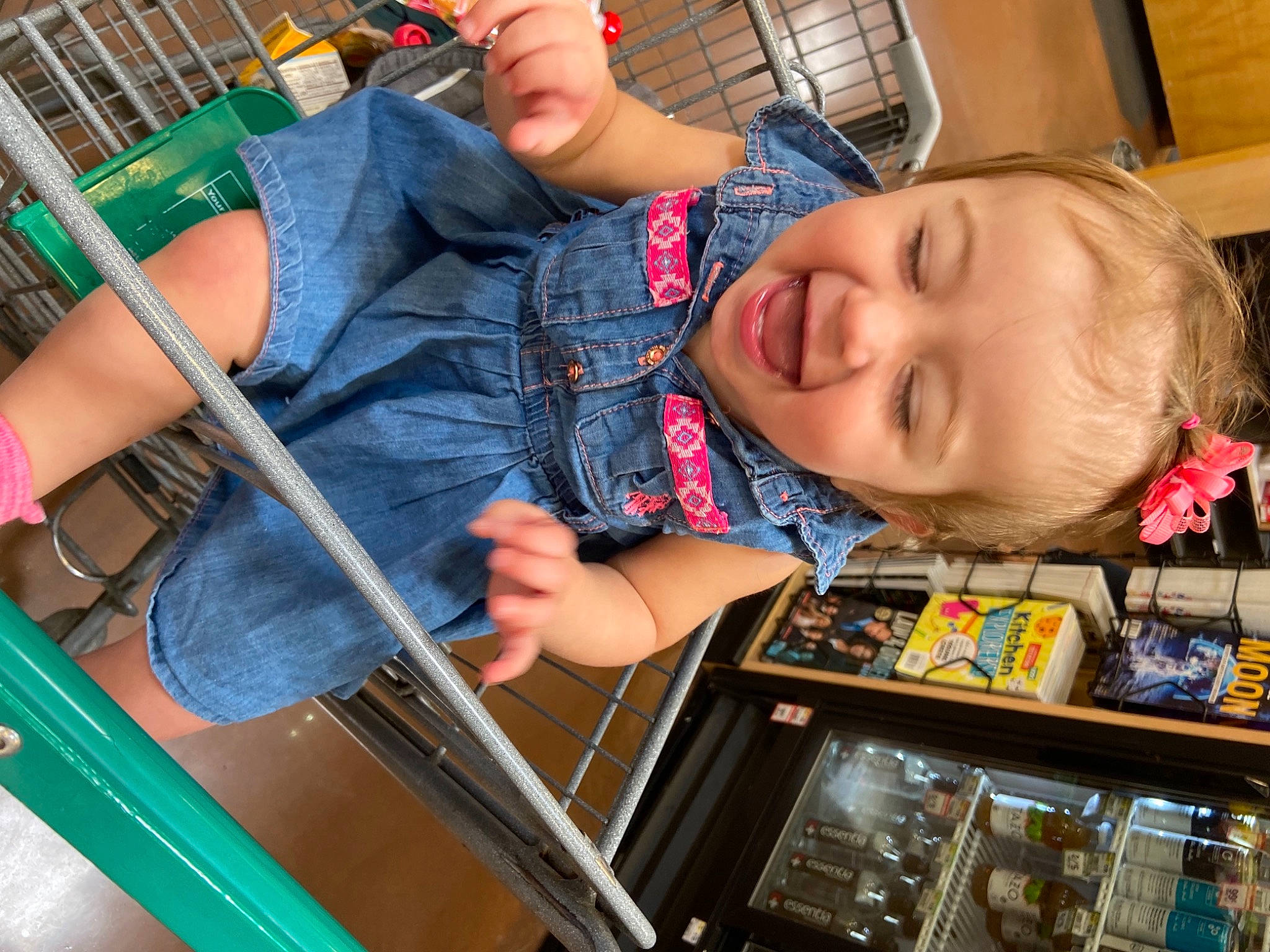 Lily is registered to the contest to win money with this photo: arm, baby, baby_products, chair, child, denim, electric_blue, finger, fun, hand, happy, orange, person, room, sitting, smile, snapshot, t_shirt, thigh, toddler
