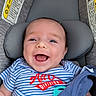 Sonny joined the competition — help win amazing prizes! baby, infant, child, smiling, laughing, car_seat, portrait, face, blue_eyes, striped_clothing, onesie, pacifier, seatbelt, vehicle, travel, indoor, close_up, happy, head, safety_sign