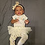 Azari joined the competition — help win amazing prizes! baby, beige, child, clothing, cute, face, gray_background, happy, headband, heart_pattern, indoor, infant, leggings, lying_down, pattern, person, smiling, socks, tutu, white